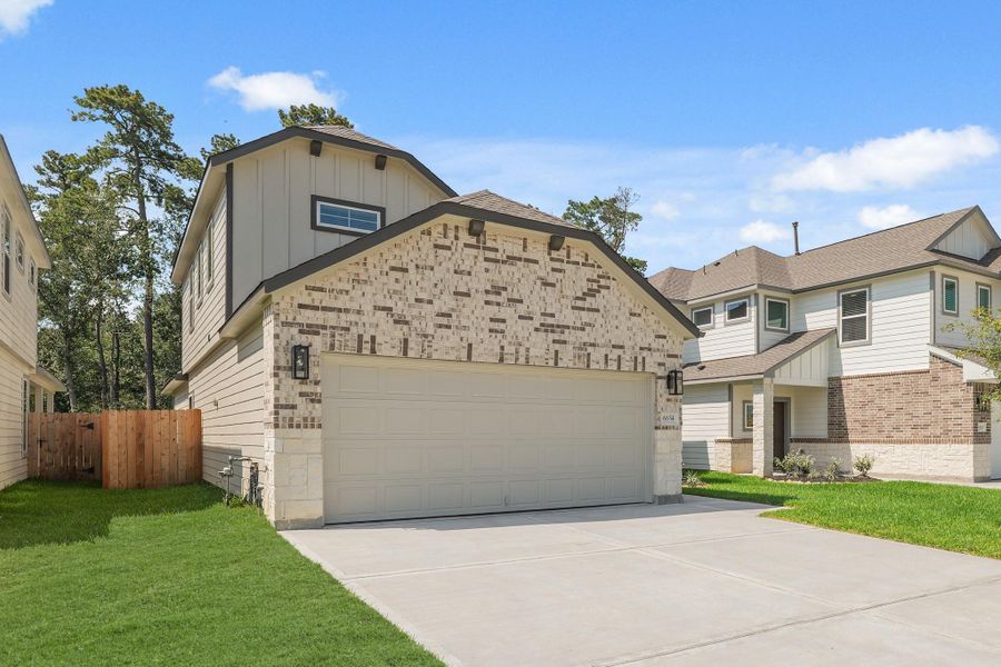 Front exterior of a new home in Cypresswood Landing, Humble, TX, highlighting curb appeal (Image 22).