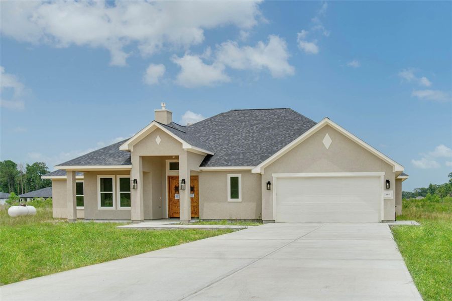 Front exterior of a new home in , Dayton, TX, highlighting curb appeal (Image 1).
