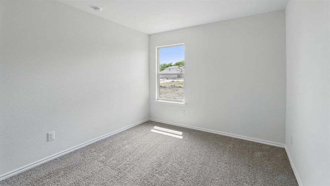 Unfurnished room with carpet floors and baseboards