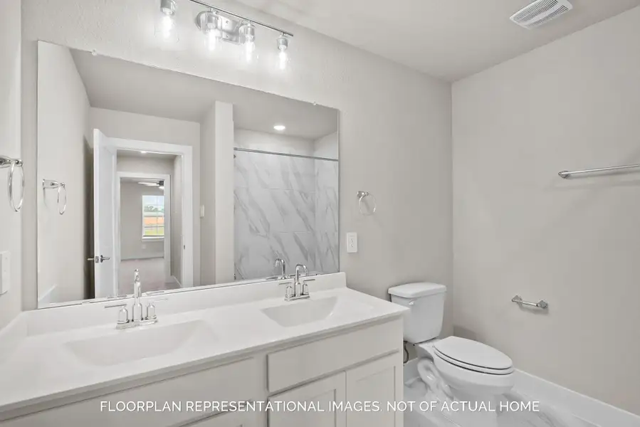 Furnished interior view inside a new home in The Oaks on 6th Street, Magnolia (Image 8).