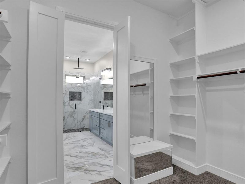 Primary bedroom custom closet.