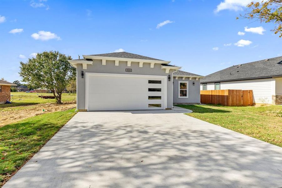 Front exterior of a new home in , Gun Barrel City, TX, highlighting curb appeal (Image 2).