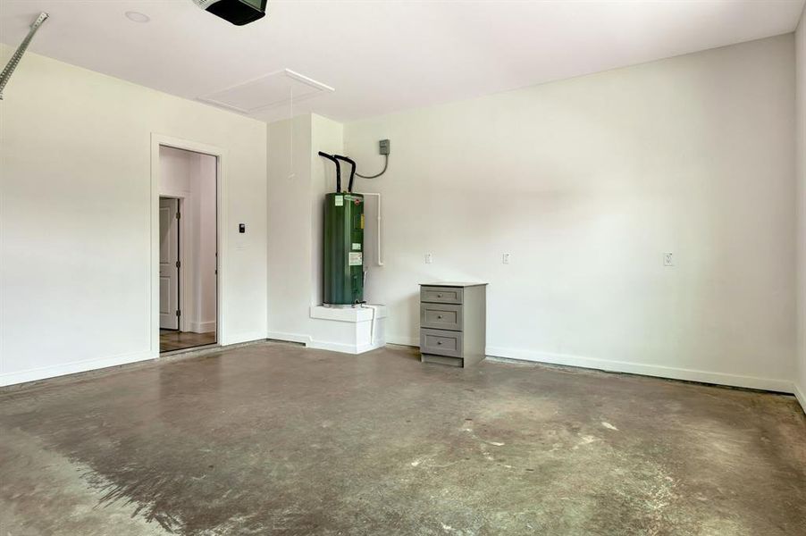 Two-car garage with built-in cabinet and water heater. Two-car garage with built-in cabinet and water heater.