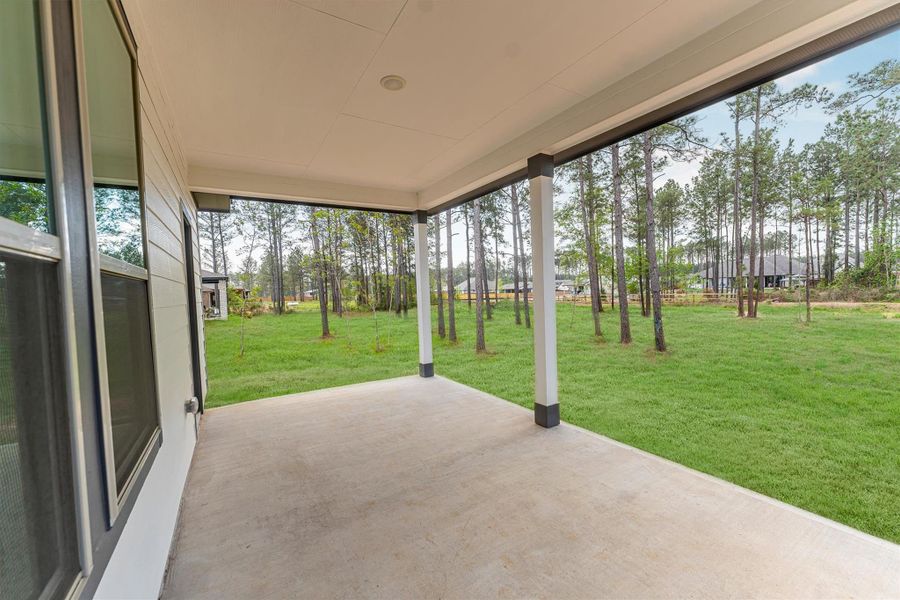 Exterior details and patio area of a home in Deer Pines, Conroe (Image 29).