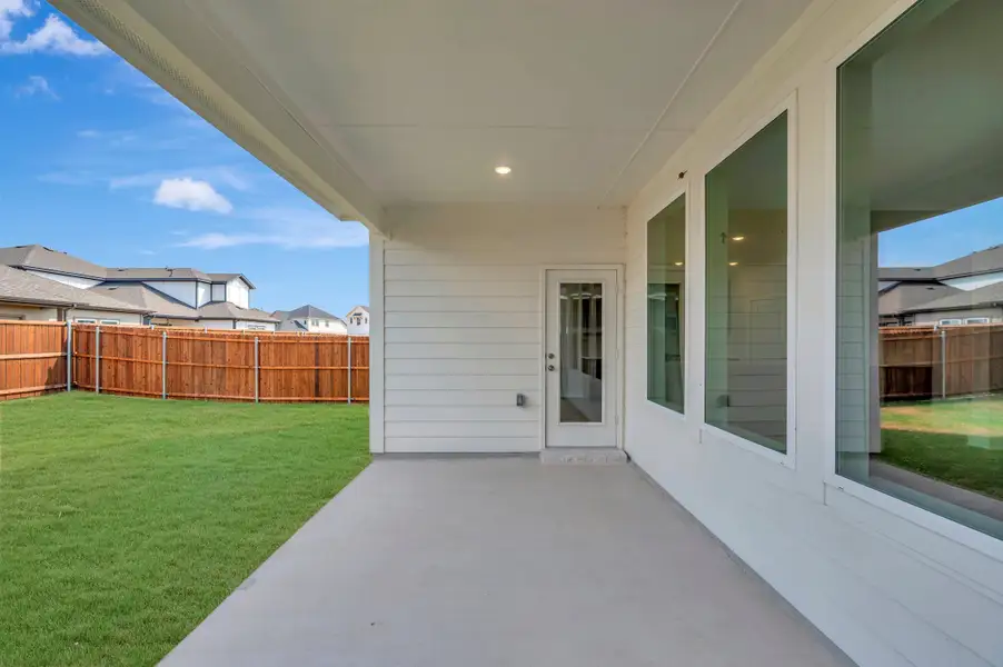 Exterior details and patio area of a home in The Meadows, Denton (Image 18).