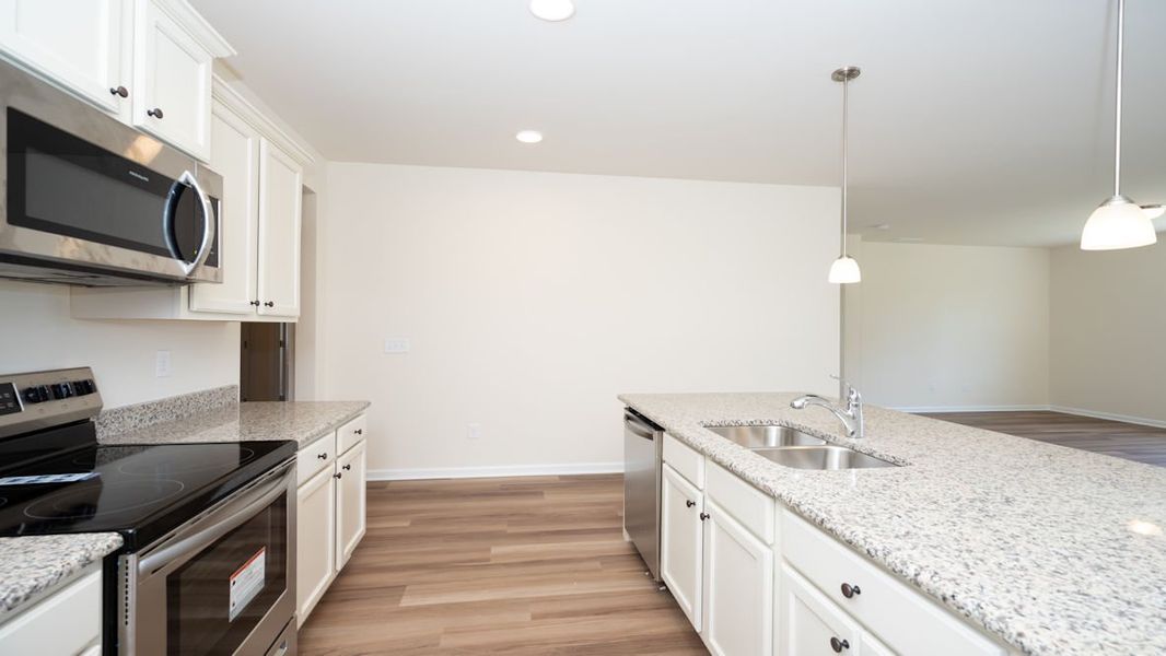 Representative furnished interior of a home built from the CALI by D.R. Horton in Lochaven, Conway (Image 12).