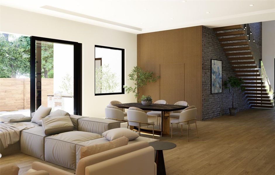 Spacious living area with modern staircase, large windows, and seamless indoor-outdoor flow.