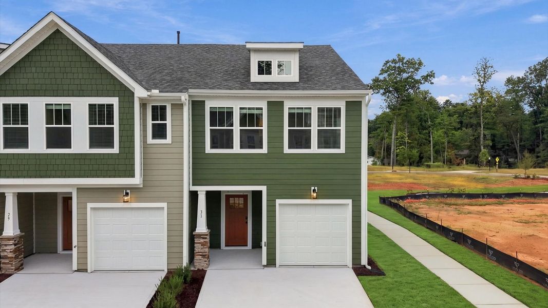 Front exterior of a new home in Brookland Place, Hendersonville, NC, highlighting curb appeal (Image 1). Front exterior of a new home in Brookland Place, Hendersonville, NC, highlighting curb appeal (Image 1).