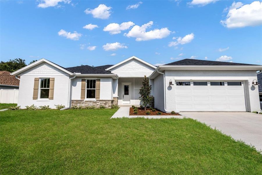 Front exterior of a new home in , Palm Coast, FL, highlighting curb appeal (Image 1). Front exterior of a new home in , Palm Coast, FL, highlighting curb appeal (Image 1).