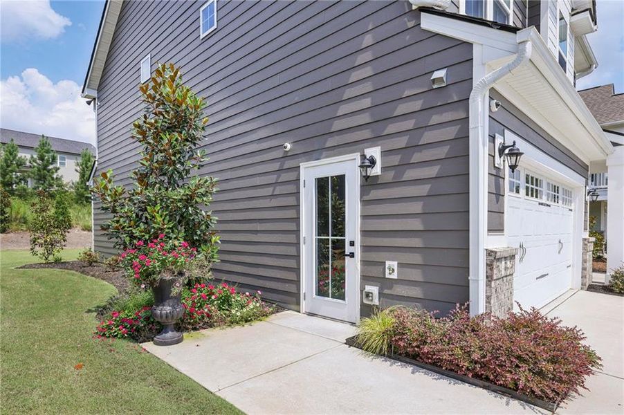 Front exterior of a new home in , Hoschton, GA, highlighting curb appeal (Image 1).