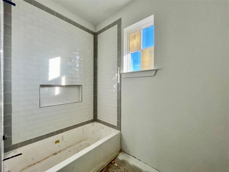 Bathroom featuring a tub to relax in