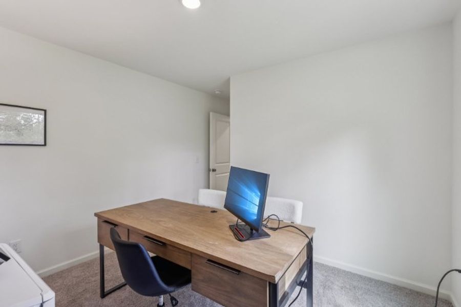 A desk with a computer on it.