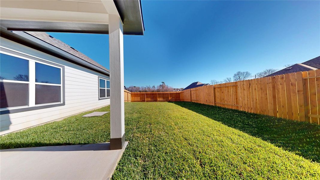 Exterior details and patio area of a home in Lexington Heights 50', Willis (Image 21).