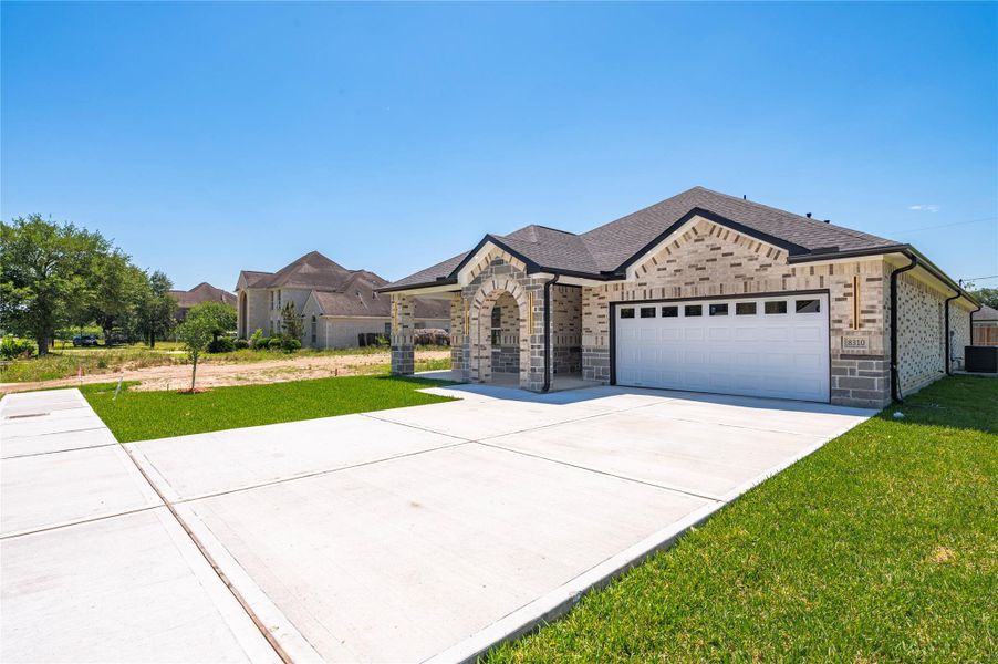 Front exterior of a new home in , Houston, TX, highlighting curb appeal (Image 23).