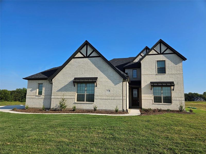 Front exterior of a new home in West Farmington, Van Alstyne, TX, highlighting curb appeal (Image 2). Front exterior of a new home in West Farmington, Van Alstyne, TX, highlighting curb appeal (Image 2).