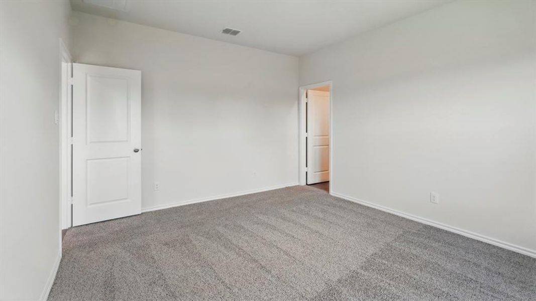Unfurnished room with carpet flooring and baseboards