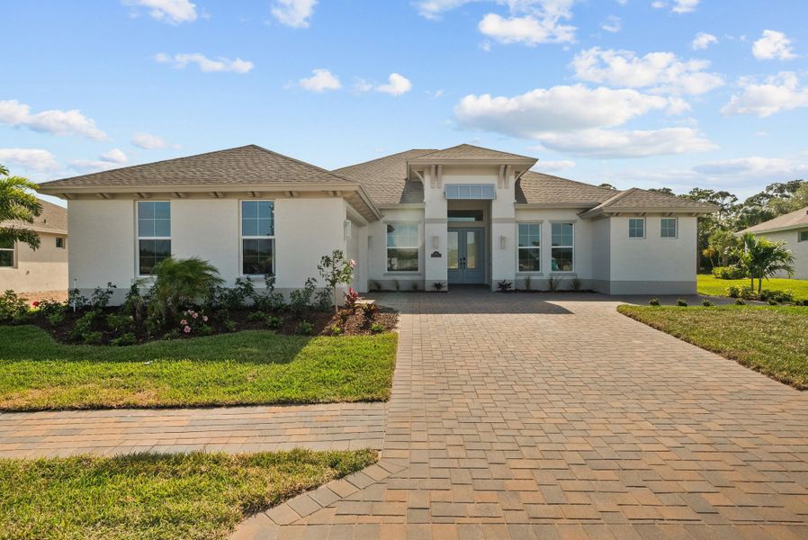 Representative exterior photo of a completed home built from the Weston Signature by GHO Homes in High Pointe, Vero Beach, FL (Image 28).