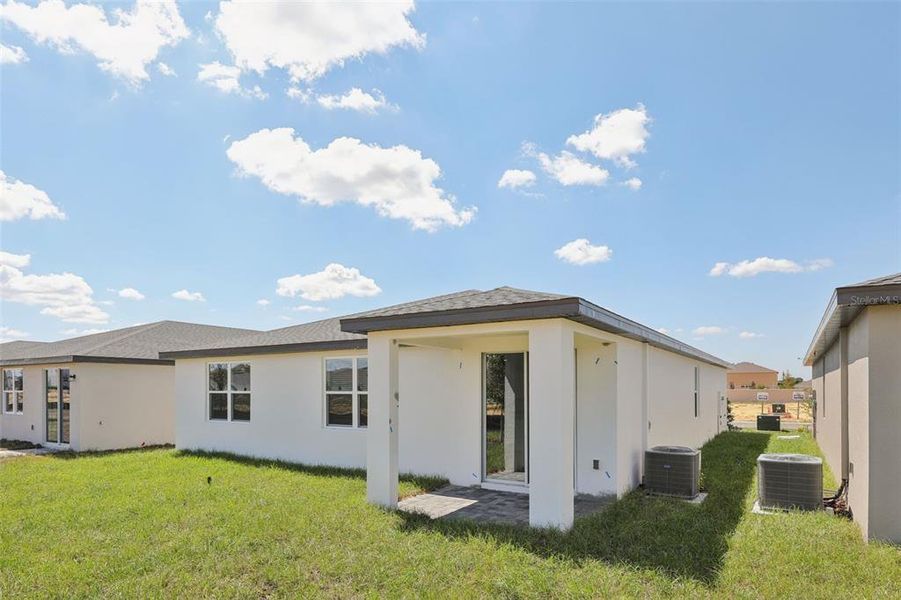 Exterior details and patio area of a home in Crosswinds - Signature Series, Haines City (Image 21).