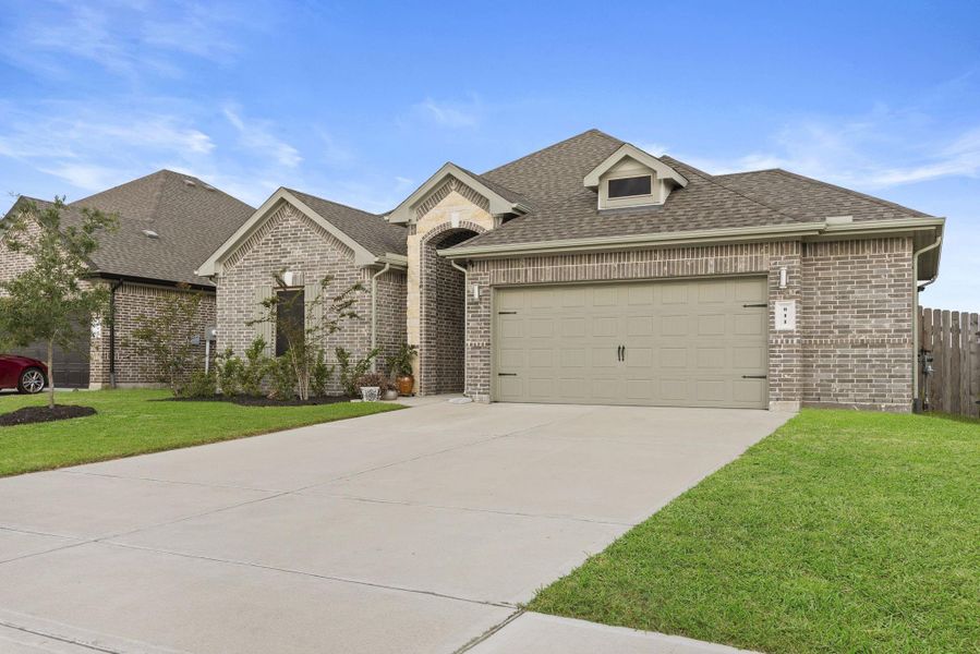 Front exterior of a new home in Westwood, League City, TX, highlighting curb appeal (Image 1). Front exterior of a new home in Westwood, League City, TX, highlighting curb appeal (Image 1).