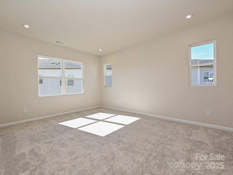 Primary Suite Surrounded by Energy Efficient Windows. Primary Suite Surrounded by Energy Efficient Windows.