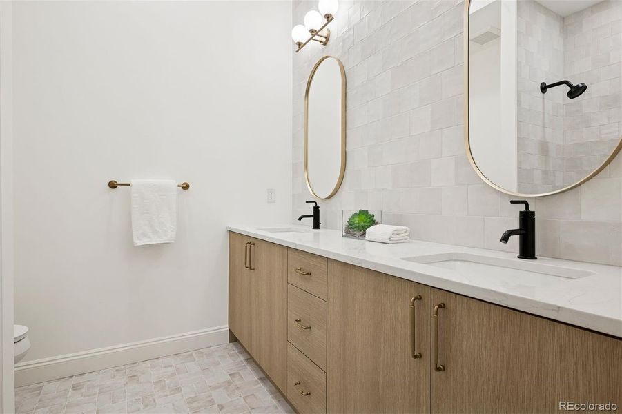 Basement bath with double sinks & tub/shower combo!