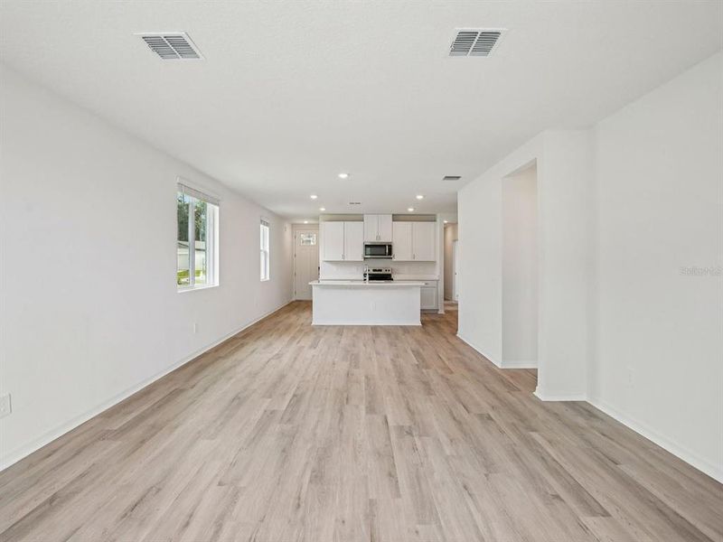Spacious, unfurnished interior of a new home in The Grove at Stuart Crossing - Premier Series, Bartow (Image 12).