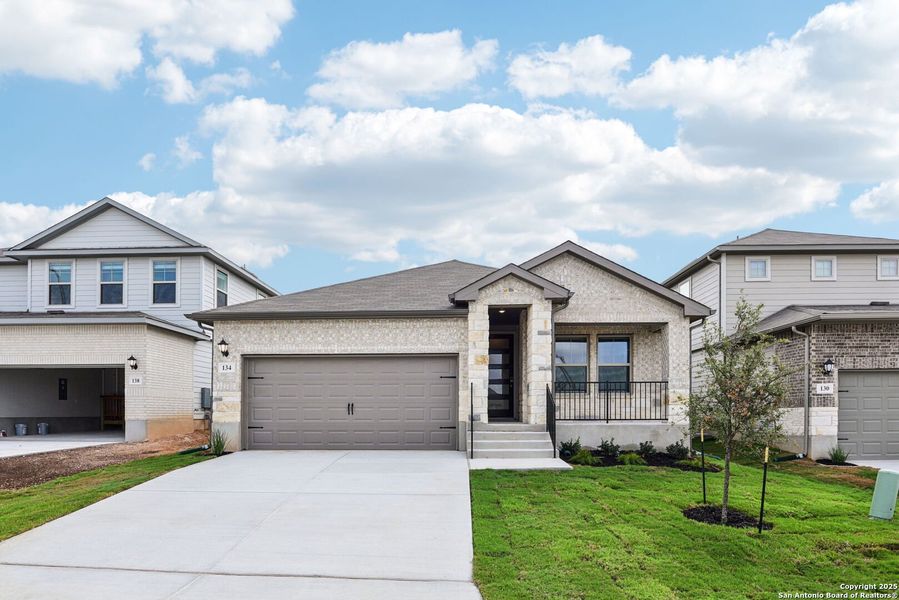 Front exterior of a new home in Legendary Trails - Premier Series, Cibolo, TX, highlighting curb appeal (Image 19). Front exterior of a new home in Legendary Trails - Premier Series, Cibolo, TX, highlighting curb appeal (Image 19).