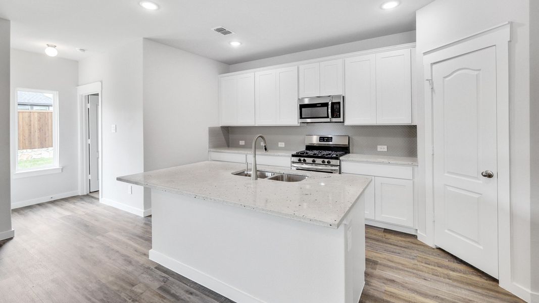 Representative furnished interior of a home built from the Meyerson by Brightland Homes in Sunterra, Katy (Image 5).