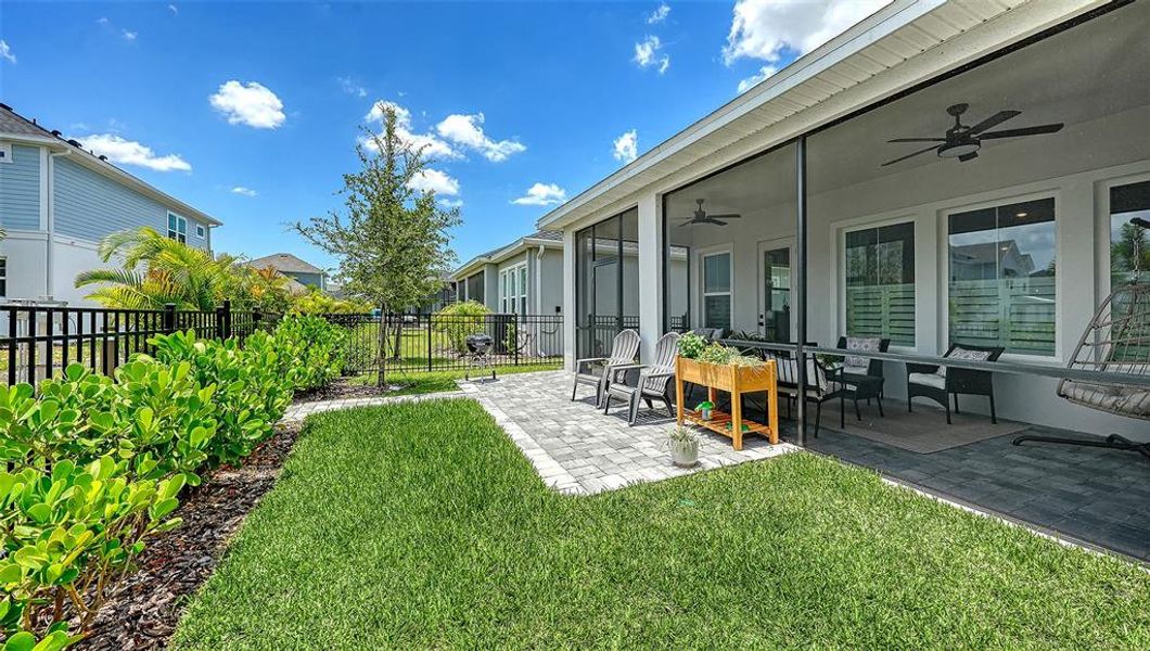 Exterior details and patio area of a home in Emerald Landing at Waterside at Lakewood Ranch – Lake Series, Sarasota (Image 25).