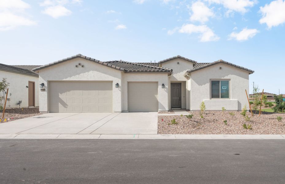 Front exterior of a new home in Sun City Anthem at Merrill Ranch, Florence, AZ, highlighting curb appeal (Image 1). Front exterior of a new home in Sun City Anthem at Merrill Ranch, Florence, AZ, highlighting curb appeal (Image 1).