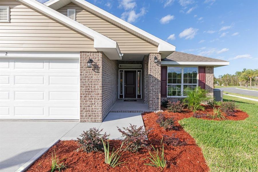 Front exterior of a new home in Palm Coast, Palm Coast, FL, highlighting curb appeal (Image 1).