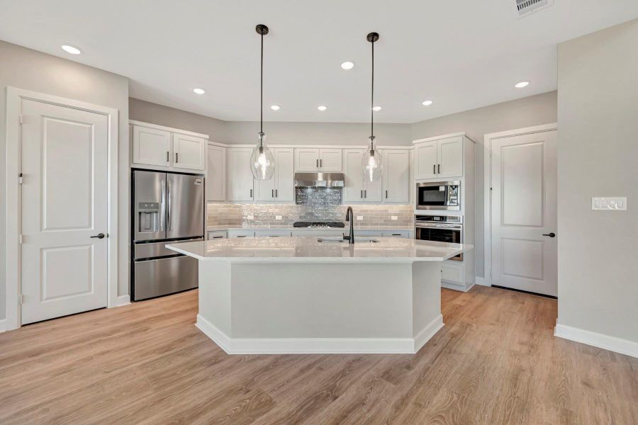 Furnished interior view inside a new home in COLTON - Reserve Collection, Todd Mission (Image 8).