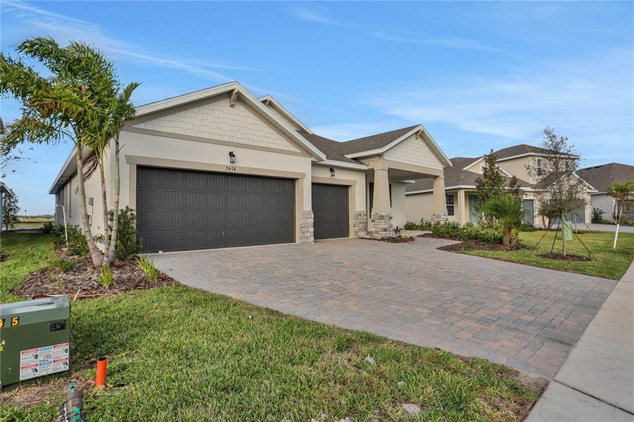 Front exterior of a new home in Seaire, Parrish, FL, highlighting curb appeal (Image 1). Front exterior of a new home in Seaire, Parrish, FL, highlighting curb appeal (Image 1).