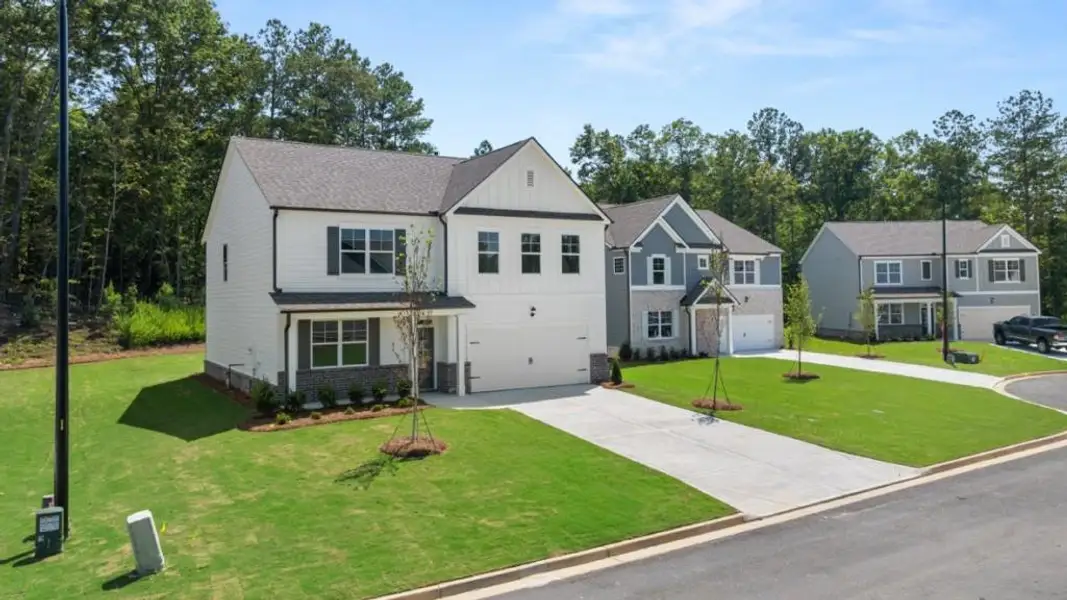 Front exterior of a new home in Parkside at Carter Grove, Cartersville, GA, highlighting curb appeal (Image 2).