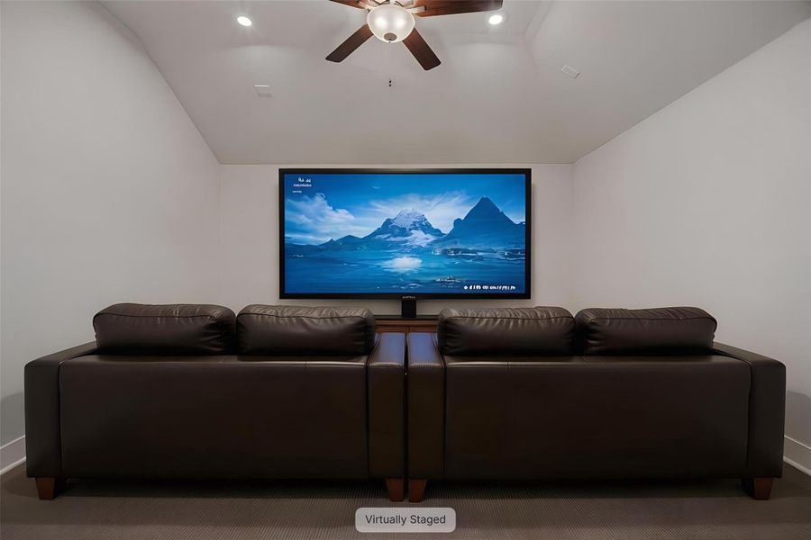 A spacious media room offers comfortable seating and ample entertainment for movie nights.