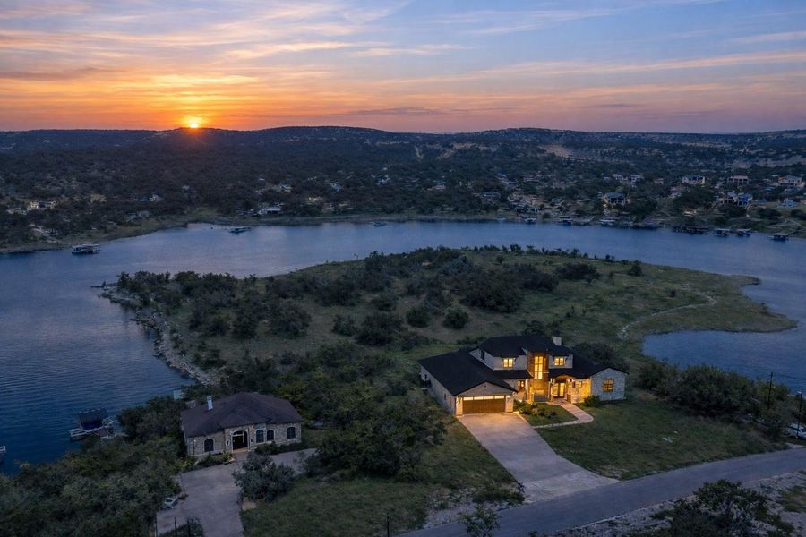 Imagine owning this iconic Lake Travis waterfront estate—over 7.5 acres of private shoreline, sweeping panoramic views, and spectacular sunsets, with a luxury residence offered to be built on this extraordinary homesite.
