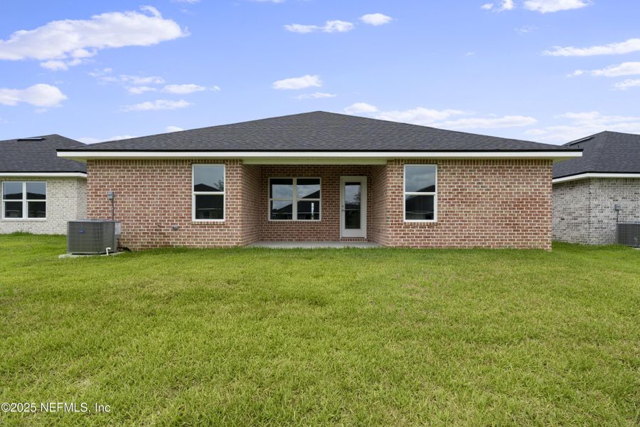 Front exterior of a new home in Shadow Crest at Rolling Hills, Green Cove Springs, FL, highlighting curb appeal (Image 13).