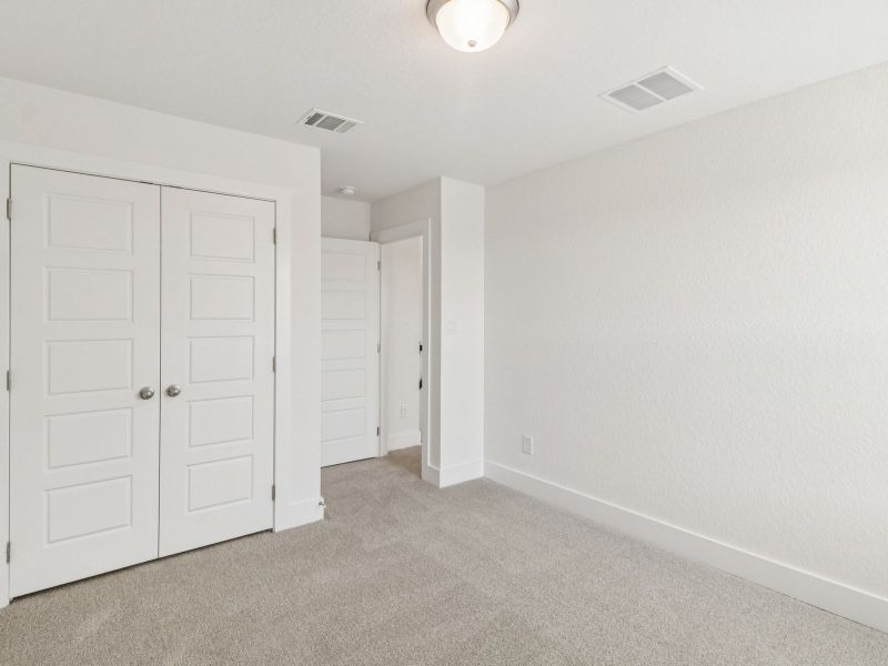 Guest bedroom in the Matador floorplan at a Meritage Homes community. Guest bedroom in the Matador floorplan at a Meritage Homes community.