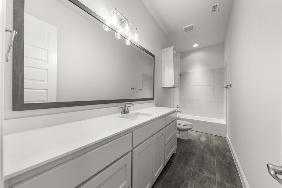 Representative furnished interior of a home built from the Jordan by Windsor Homes in Nelson Lake Estates, Rockwall (Image 9).
