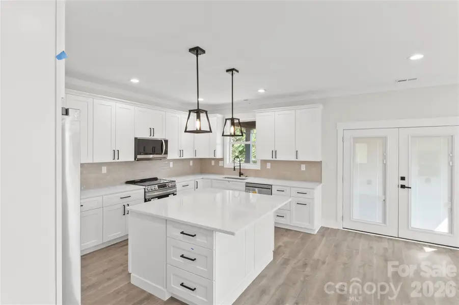 Very large and open kitchen with a ton of cabinet space. Quartz counter tops. Over size island with drawers and cabinets on three sides for extra storage.All soft close darwaers and cabinets