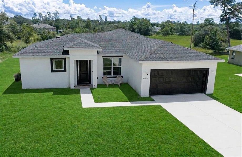 Front exterior of a new home in , Ocala, FL, highlighting curb appeal (Image 25).