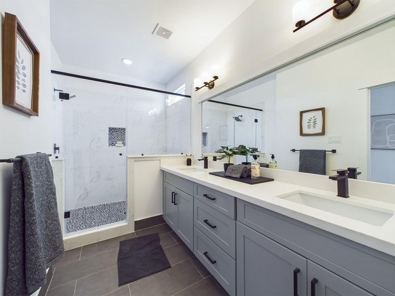 MOVE-IN READY! Offering a beautiful primary bathroom with a walk-in shower and double sink vanity with quartz countertops. FINISHES & FLOOR PLANS MAY VARY!