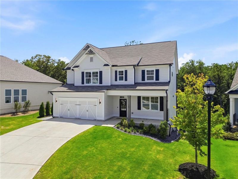 Front exterior of a new home in , Woodstock, GA, highlighting curb appeal (Image 2). Front exterior of a new home in , Woodstock, GA, highlighting curb appeal (Image 2).