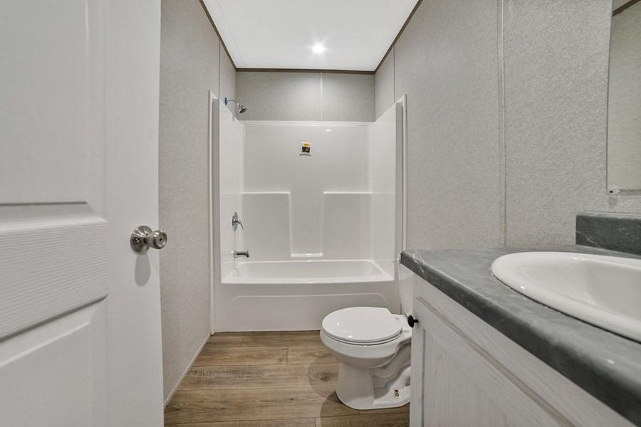 Full bathroom featuring bath / shower combination, and vanity Full bathroom featuring bath / shower combination, and vanity