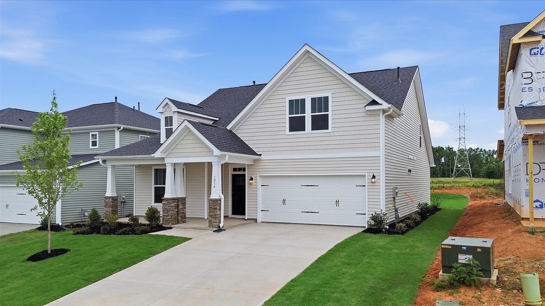 Front exterior of a new home in Fox Hollow, Spartanburg, SC, highlighting curb appeal (Image 2). Front exterior of a new home in Fox Hollow, Spartanburg, SC, highlighting curb appeal (Image 2).