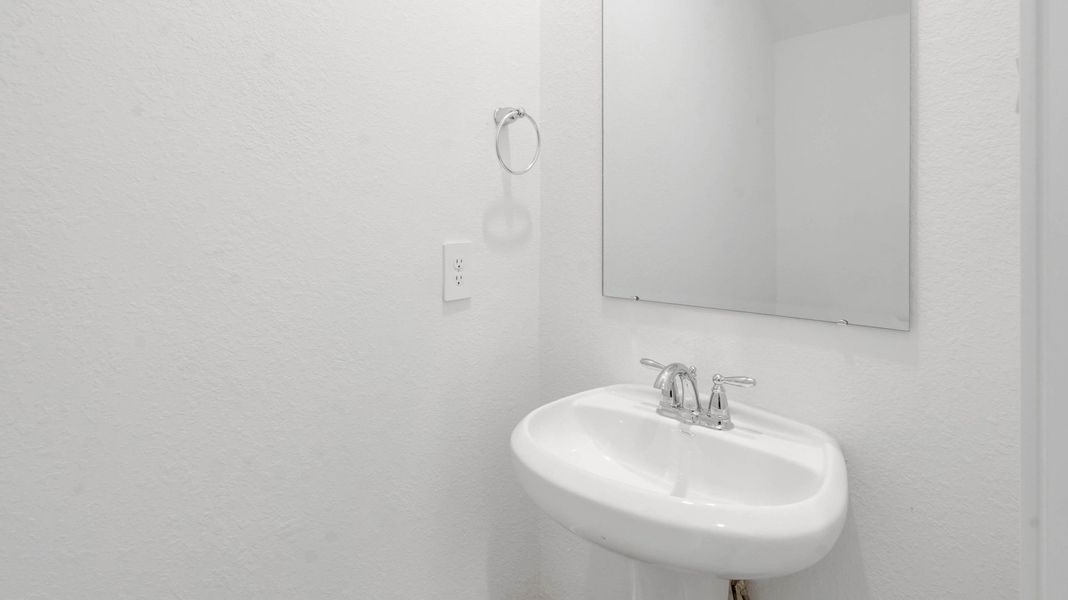 Representative furnished interior of a home built from the Jasmine by D.R. Horton in Grand West, Houston (Image 9).