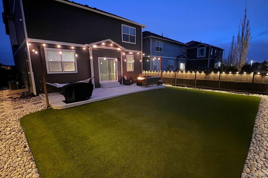 Exterior details and patio area of a home in Settlers Crossing, Commerce City (Image 21).