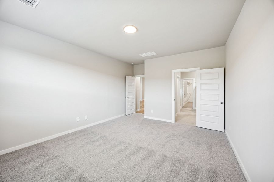 Primary Suite in the Willow home plan by Trophy Signature Homes – REPRESENTATIVE PHOTO