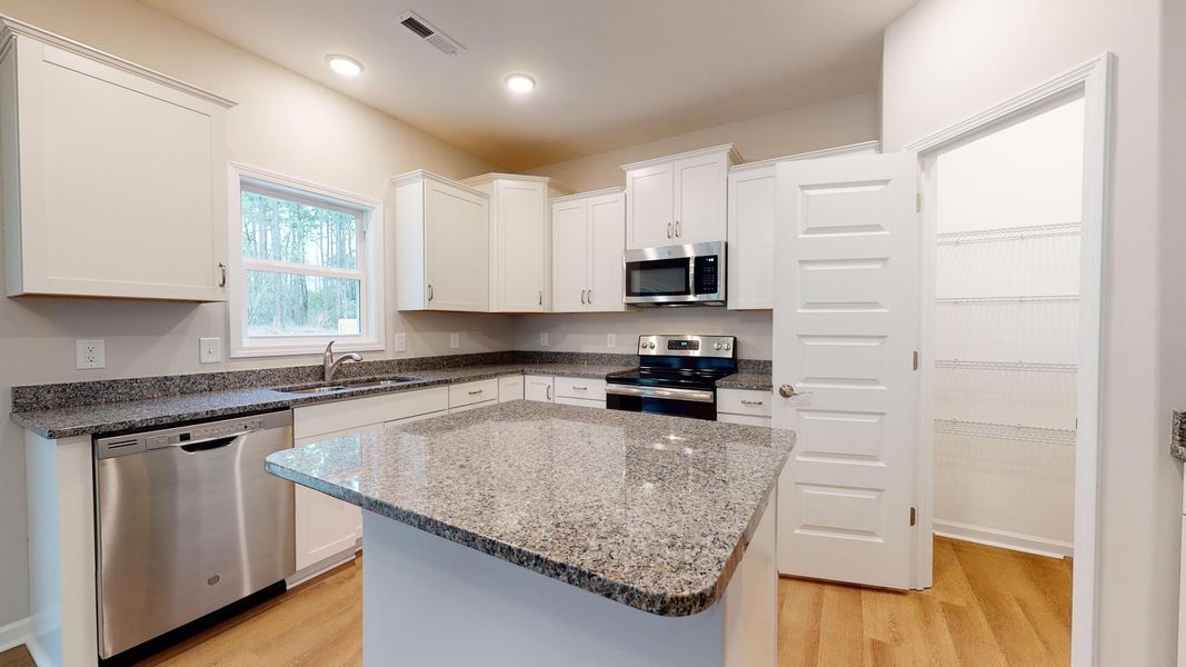 Representative furnished interior of a home built from the Thornwood A by JC Jackson Homes,LLC in Heritage Pointe, Newport (Image 7).