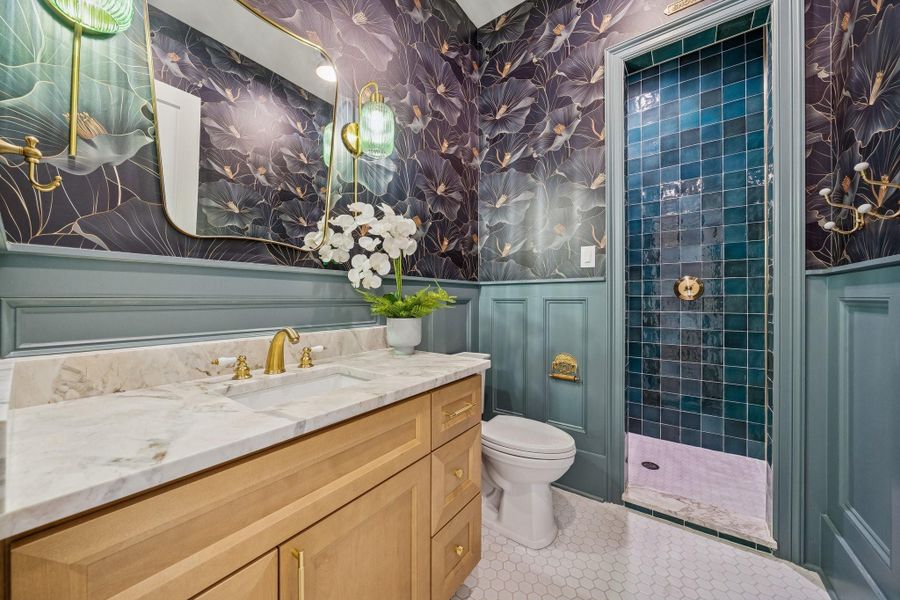 The most gorgeous guest bathroom next to the foyer. That green tile is perfection.